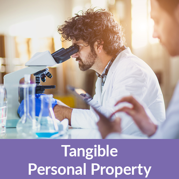 Scientists looking through a microscope. Tangible Personal Property Rollover Scientists looking through a microscope. Tangible Personal Property Rollover