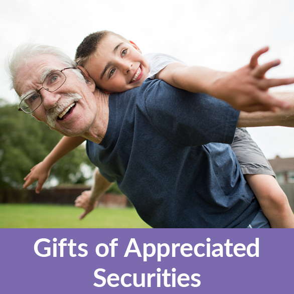 A man playing with their grandchild. Gifts of Appreciated Securities Rollover A man playing with their grandchild. Gifts of Appreciated Securities Rollover
